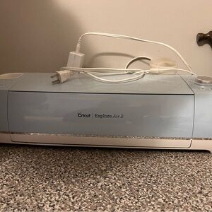 Cricut Explore 2 with heat press, tools, and vinyl